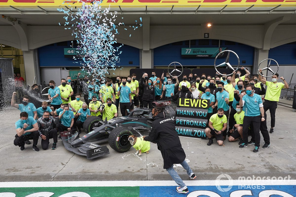 Lewis Hamilton, Mercedes-AMG F1, celebrates with his team by and Valtteri Bottas, Mercedes-AMG F1 after winning his 7th championship, by spraying champagne