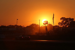 Track action at sunset