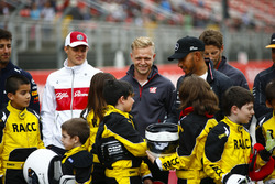 Young karters backed by the RACC, Spain's largest auto club, pose with Daniel Ricciardo, Red Bull Racing, Marcus Ericsson, Sauber, Kevin Magnussen, Haas F1 Team, Lewis Hamilton, Mercedes AMG F1, Romain Grosjean, Haas F1 Team, and Stoffel Vandoorne, McLaren
