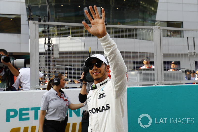 Pole winner Lewis Hamilton, Mercedes AMG F1, waves to fans