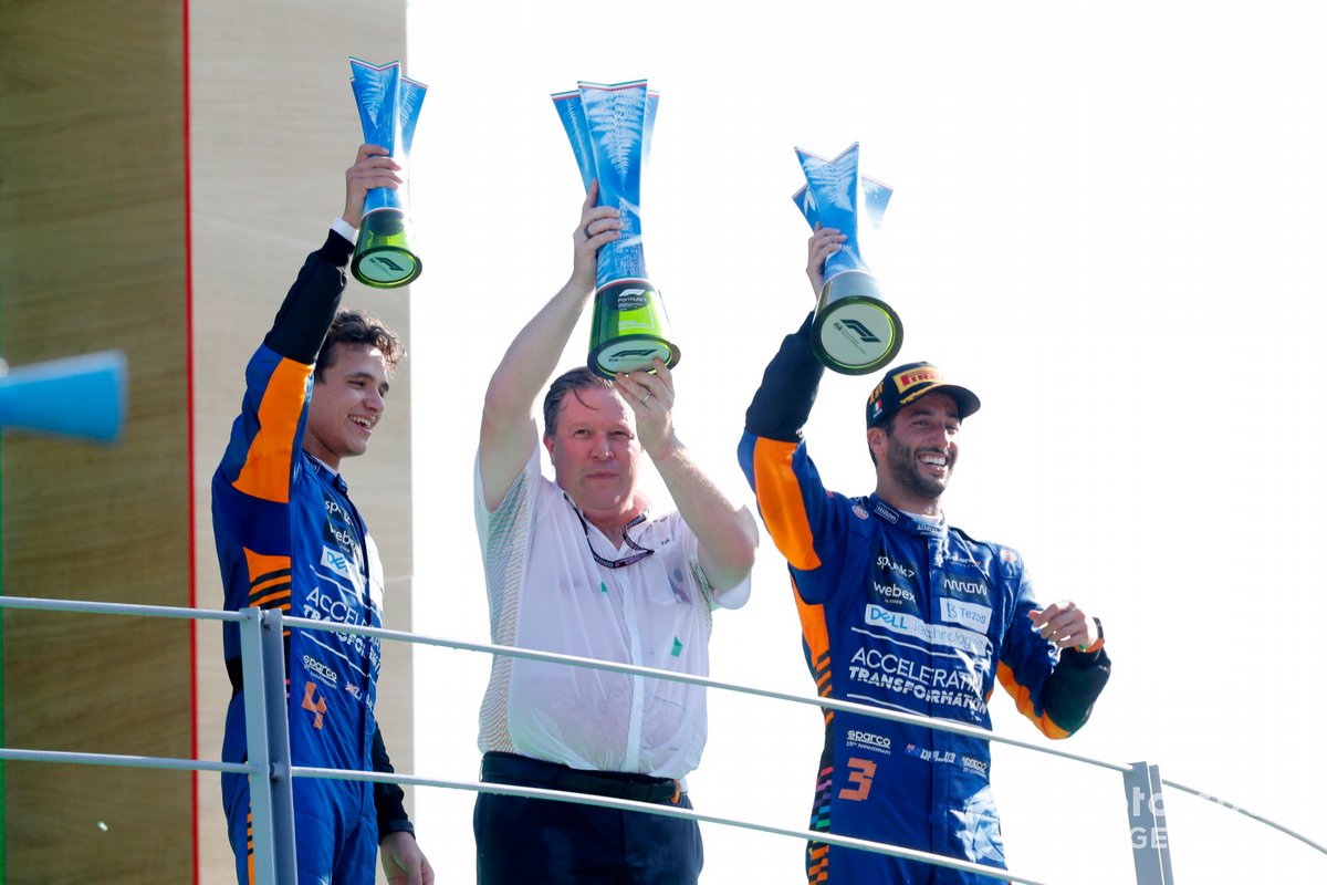 Lando Norris, McLaren, 2nd position, Zak Brown, CEO, McLaren Racing, and Daniel Ricciardo, McLaren, 1st position, with the trophies