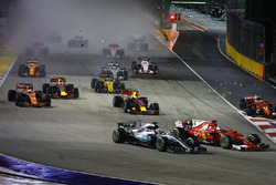 Sebastian Vettel, Ferrari SF70H, Max Verstappen, Red Bull Racing RB13, Kimi Raikkonen, Ferrari SF70H, collide at the start as Lewis Hamilton, Mercedes AMG F1 W08, finds his way through