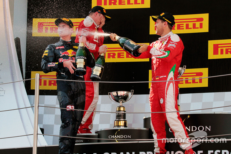 (L to R): race winner Max Verstappen, Red Bull Racing celebrates with the champagne with Sebastian V