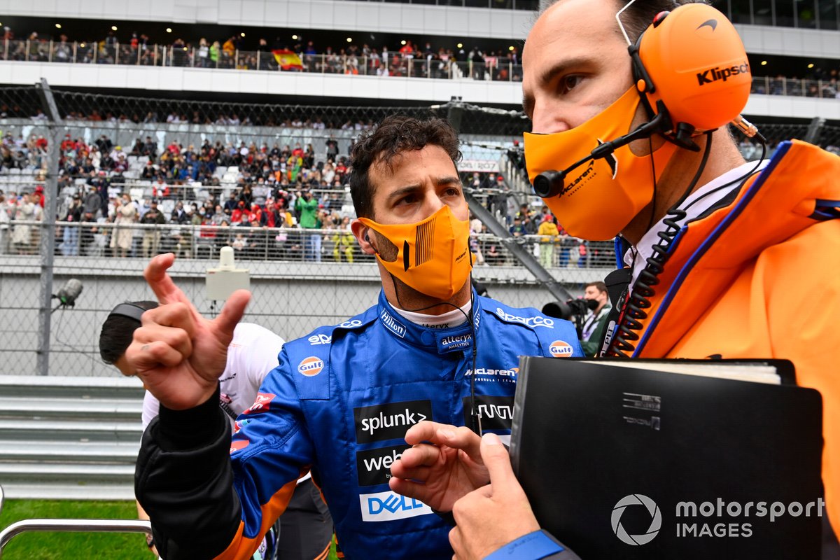 Daniel Ricciardo, McLaren, on the grid with his race engineer