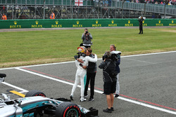 Polesitter Lewis Hamilton, Mercedes AMG F1, is congratulated by Jenson Button