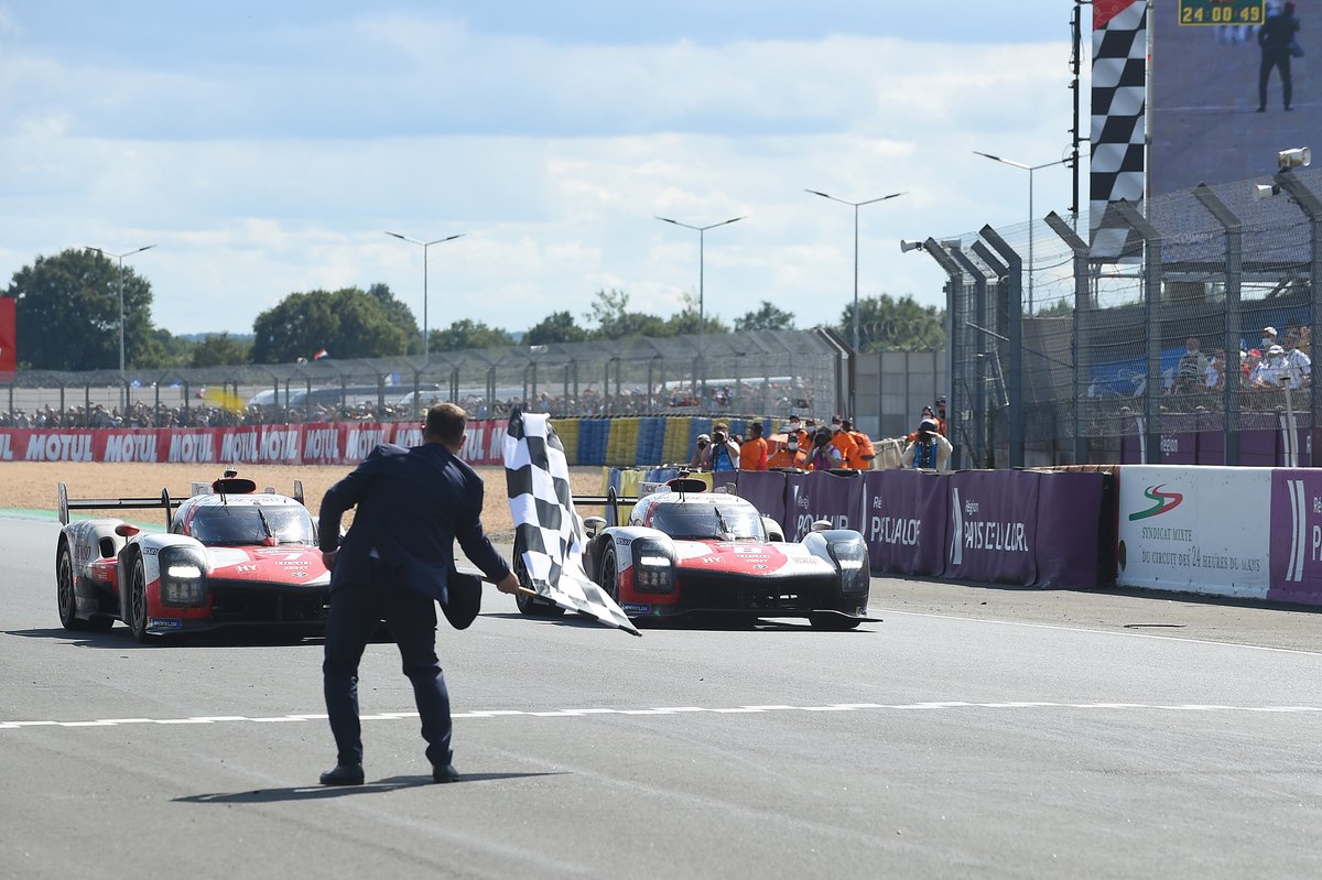 #7 Toyota Gazoo Racing Toyota GR010 - Hybrid Hypercar, Mike Conway, Kamui Kobayashi, Jose Maria Lopez, #8 Toyota Gazoo Racing Toyota GR010 - Hybrid Hypercar, Sébastien Buemi, Kazuki Nakajima, Brendon Hartley take the checkered flag.