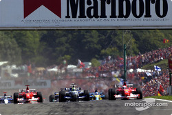 The start: Rubens Barrichello taking the lead in front of Michael Schumacher and Ralf Schumacher