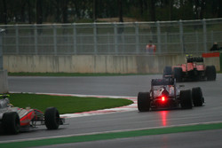 Sebastian Vettel, Red Bull Racing is passed by Fernando Alonso, Scuderia Ferrari as he retires from the race