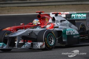 Fernando Alonso, Scuderia Ferrari and Michael Schumacher, Mercedes GP