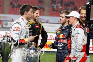Second place Sébastien Ogier and Romain Grosjean congratulate first place Sebastian Vettel and Michael Schumacher