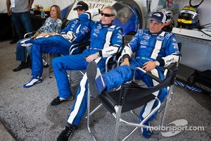 Justin Wilson, John Pew and Justin Wilson and Oswaldo Negri watch as A.J. Allmendinger battles for the lead with one hour to go