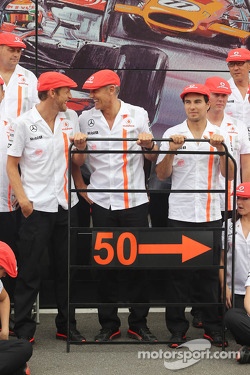 (L to R): Jenson Button, McLaren; Martin Whitmarsh, McLaren Chief Executive Officer; and Sergio Perez, McLaren celebrate 50 years of McLaren as a constructor