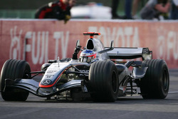 Race winner Kimi Raikkonen celebrates