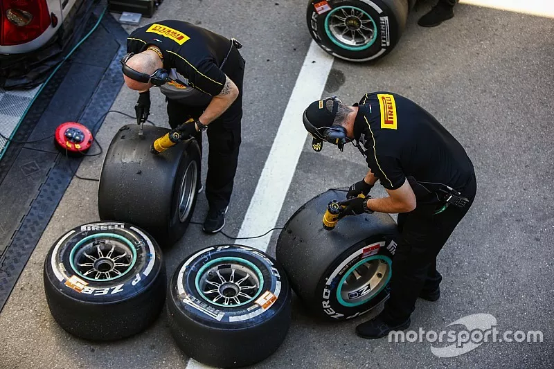 Pirelli engineers work on some tyres