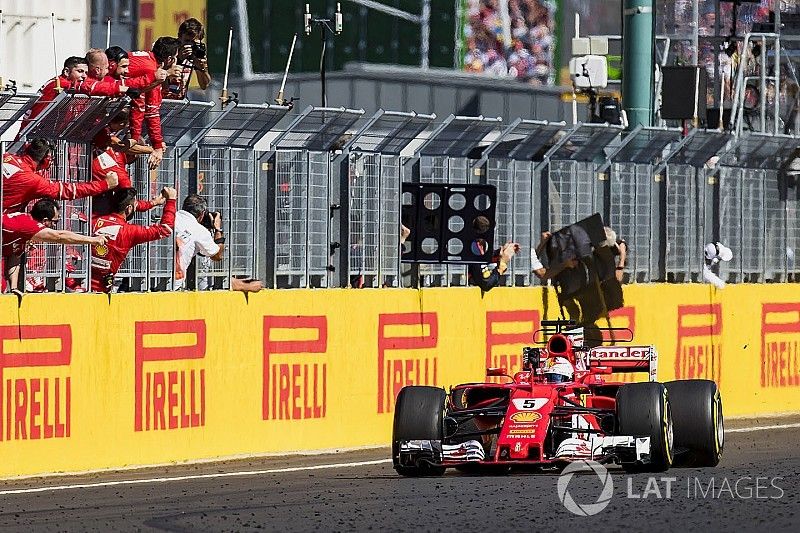 Sebastian Vettel, Ferrari SF70H, race winner, takes the chequered flag