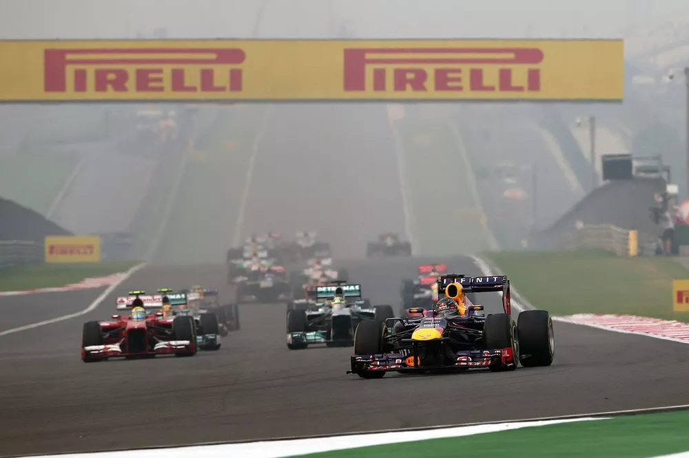 Sebastian Vettel, Red Bull Racing RB9 leads at the start of the race