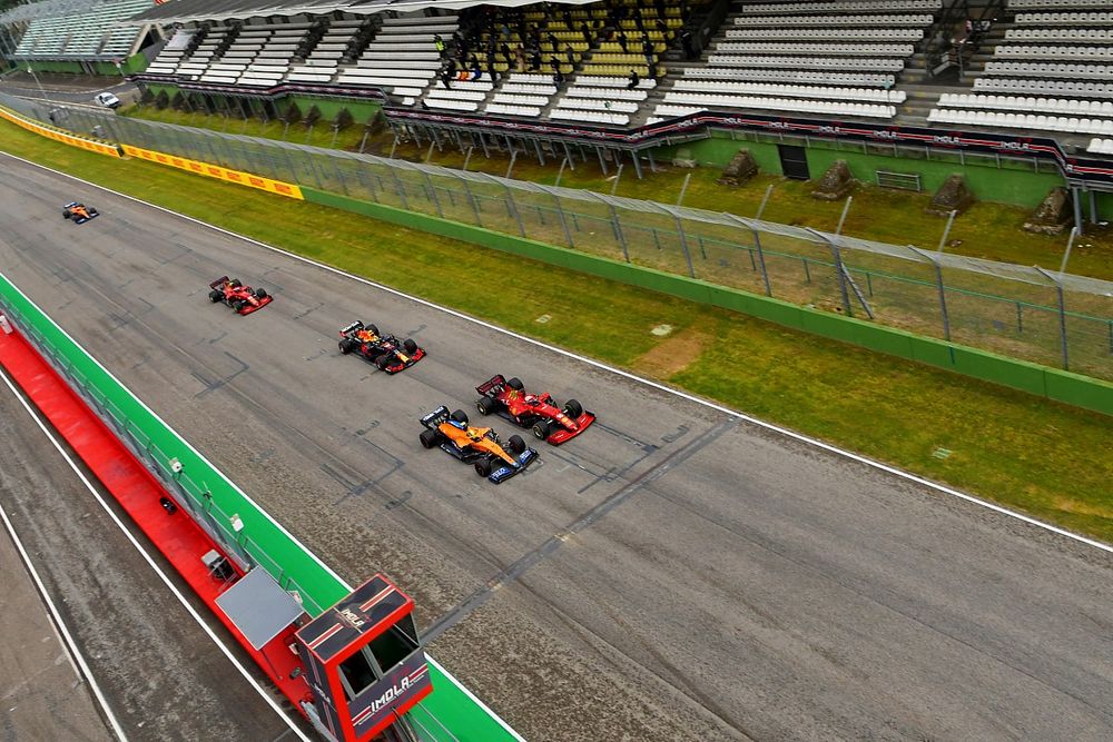 Charles Leclerc, Ferrari SF21, battles with Lando Norris, McLaren MCL35M, ahead of Sergio Perez, Red Bull Racing RB16B, Carlos Sainz Jr., Ferrari SF21, and the rest of the field