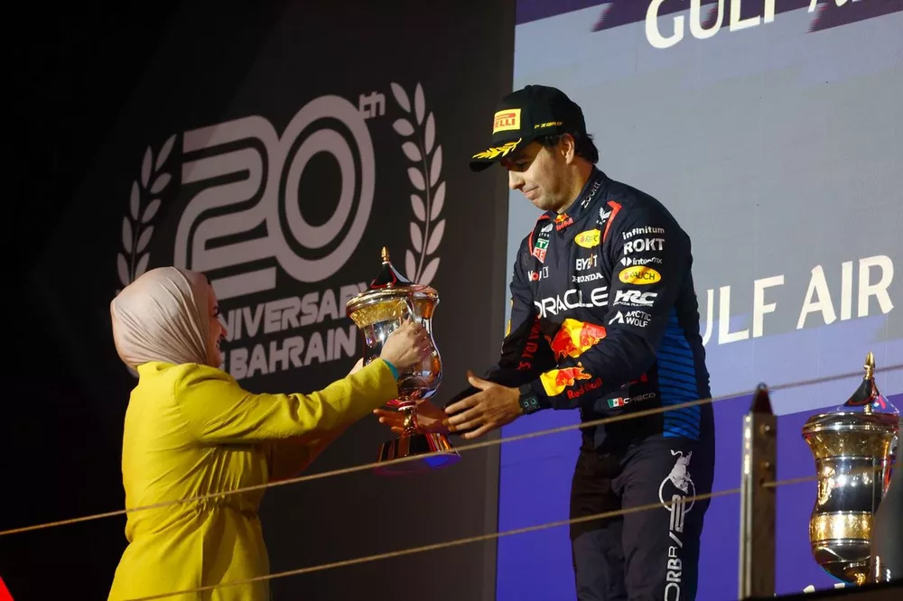 Sergio Perez, Red Bull Racing, 2nd position, receives his trophy