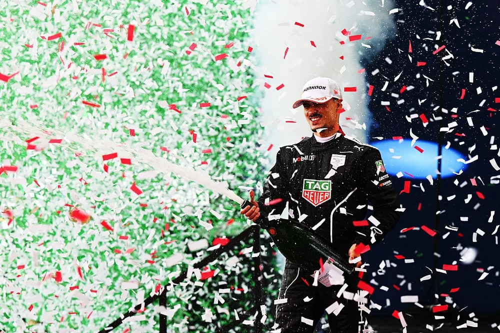 Pascal Wehrlein, Porsche, 1st position, sprays Champagne on the podium as confetti falls
