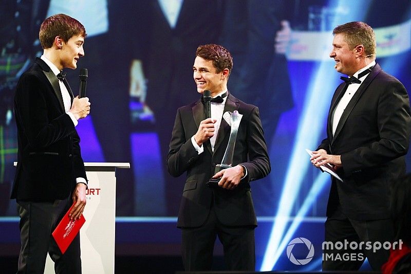 Williams F1 Driver George Russell, and McLaren F1 driver Lando Norris on stage to present the National Racing Driver Award to Dan Ticktum