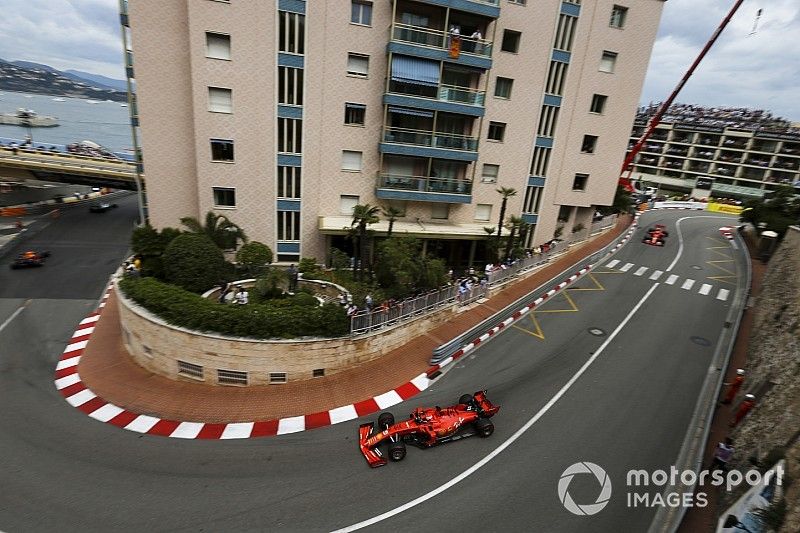 Sebastian Vettel, Ferrari SF90, leads Charles Leclerc, Ferrari SF90