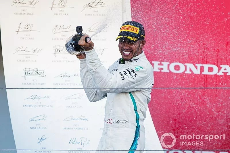 Race winner Lewis Hamilton, Mercedes AMG F1, sprays Champagne on the podium 
