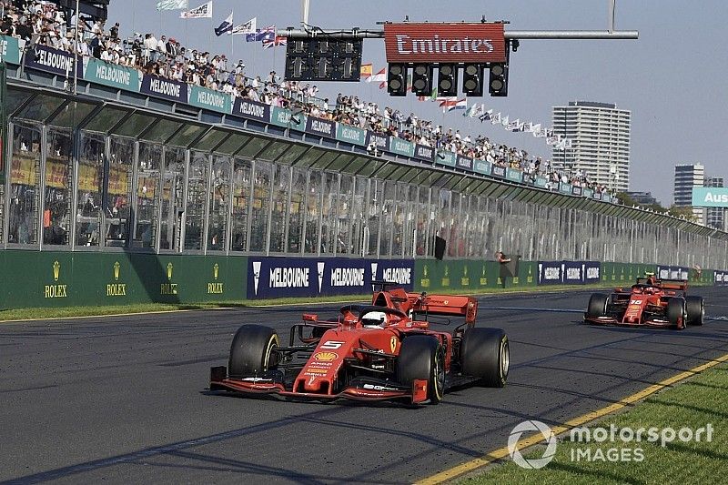 Sebastian Vettel, Ferrari SF90, leads Charles Leclerc, Ferrari SF90