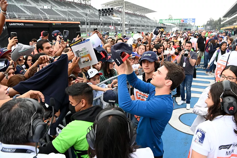 Pato O'Ward Indy car driver signs autographs