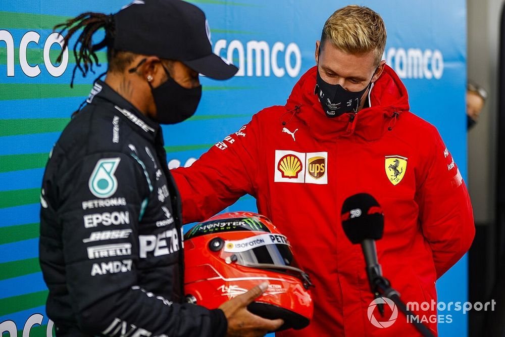 Mick Schumacher presents Lewis Hamilton, Mercedes-AMG F1, 1st position, with his fathers helmet to commemorate his equal race win record of 91