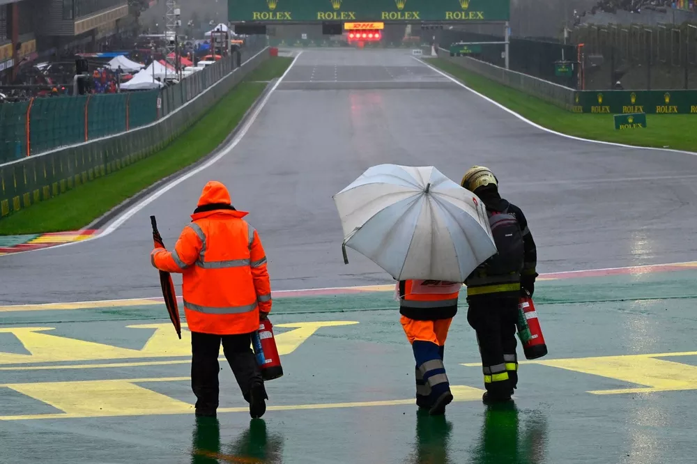 Marshals on the wet track