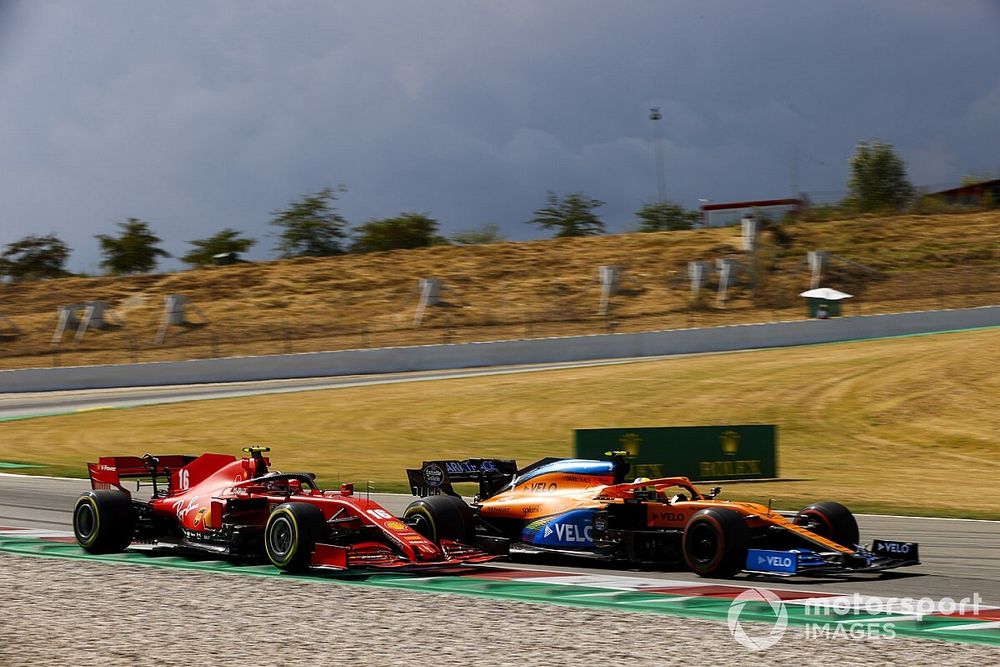 Lando Norris, McLaren MCL35, battles with Charles Leclerc, Ferrari SF1000