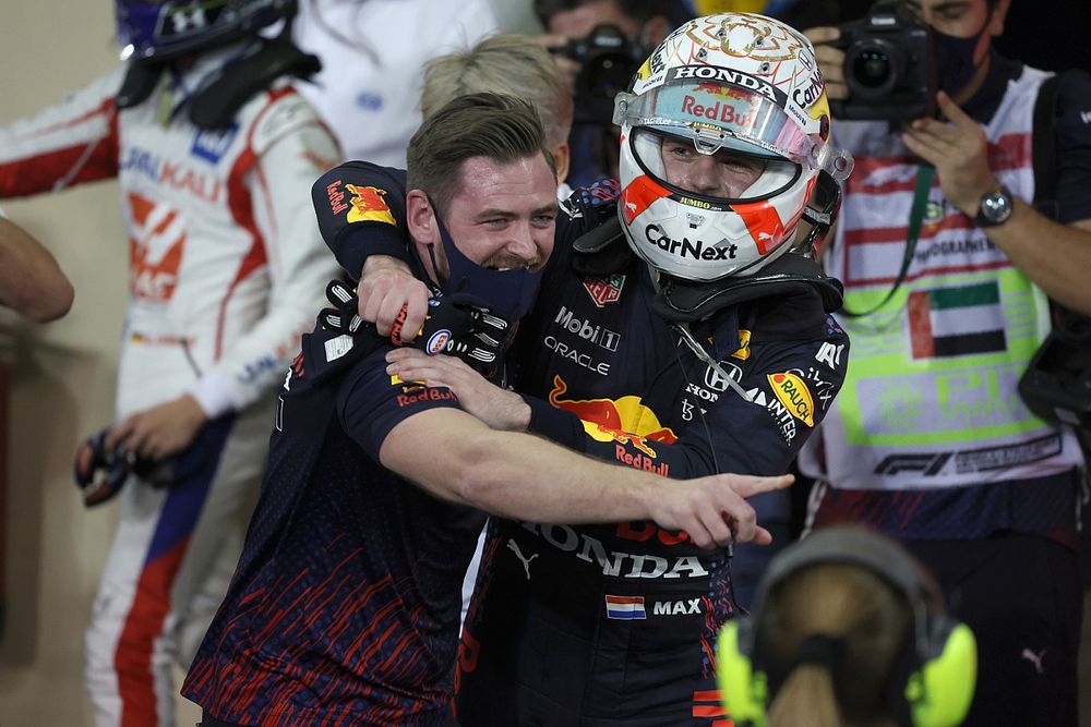 2021 drivers champion Max Verstappen, Red Bull Racing, 1st position, celebrates with a team mate in Parc Ferme