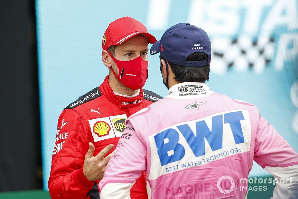 Sebastian Vettel, Ferrari, 3rd position, and Sergio Perez, Racing Point, 2nd position, talk in Parc Ferme