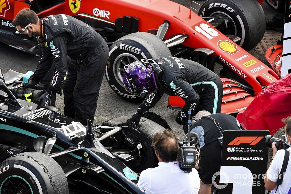 Race Winner Lewis Hamilton, Mercedes-AMG F1 looks at the damage to his car from a puncture in Parc Ferme 