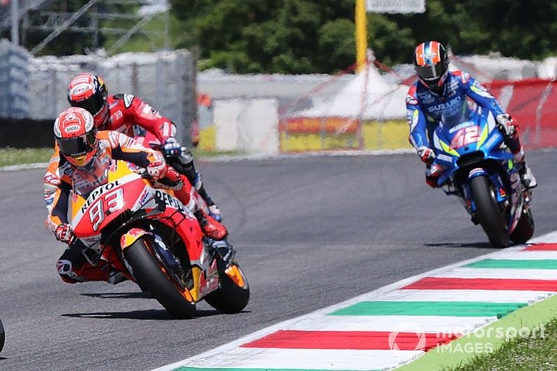 Danilo Petrucci, Ducati Team leads Marc Marquez, Repsol Honda Team