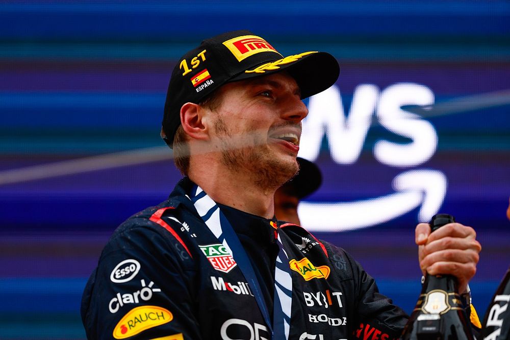 Max Verstappen, Red Bull Racing, 1st position, celebrates in the podium with Champagne