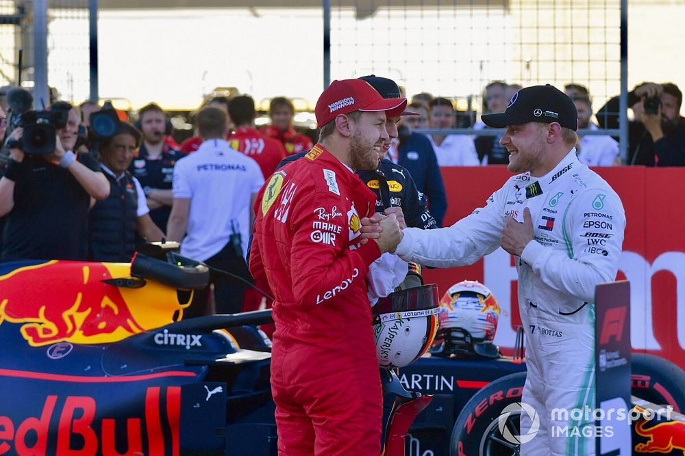 Sebastian Vettel, Ferrari, congratulates Valtteri Bottas, Mercedes AMG F1, on securing pole