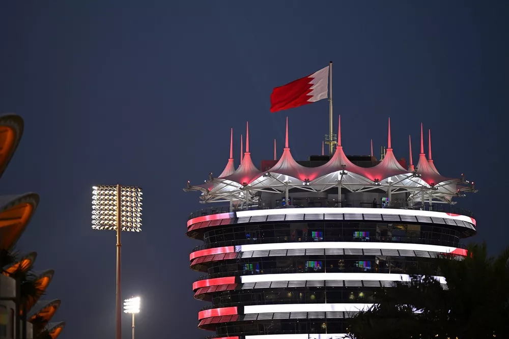 The Bahrain flag flies over the Sakhir Tower