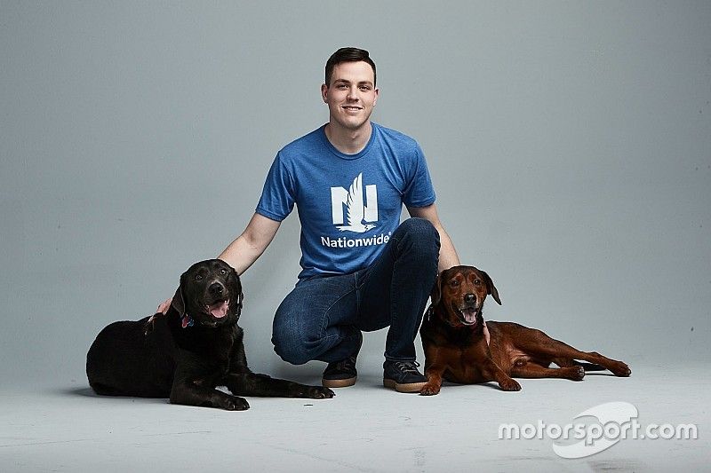 Alex Bowman with his dogs Roscoe and Finn