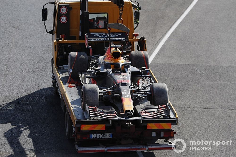 Marshals return the car of Max Verstappen, Red Bull Racing RB16, on a truck