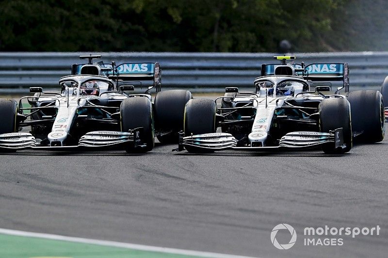 Lewis Hamilton, Mercedes AMG F1 W10, battles with Valtteri Bottas, Mercedes AMG W10, at the start