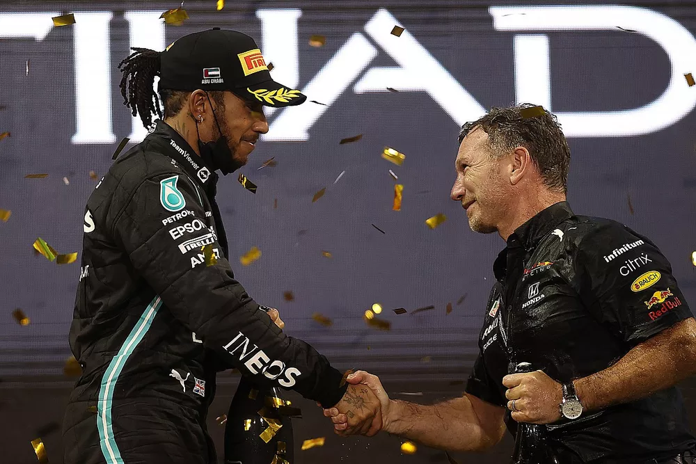 Red Bull Racing Team Principal Christian Horner shakes hands with second placed Lewis Hamilton, Mercedes