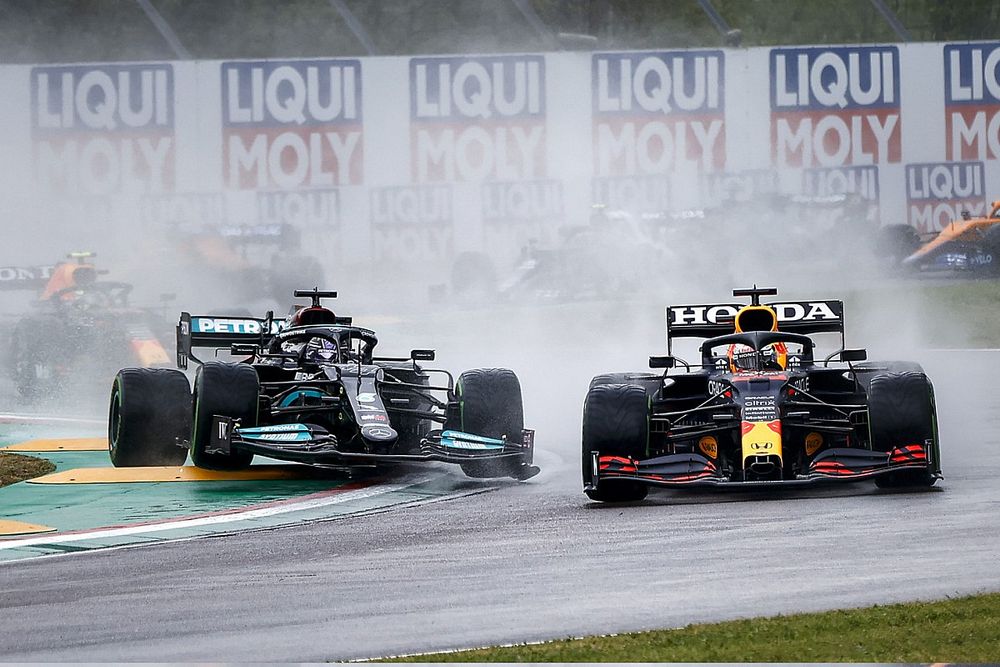 Max Verstappen, Red Bull Racing RB16B, battles with Lewis Hamilton, Mercedes W12, at the start