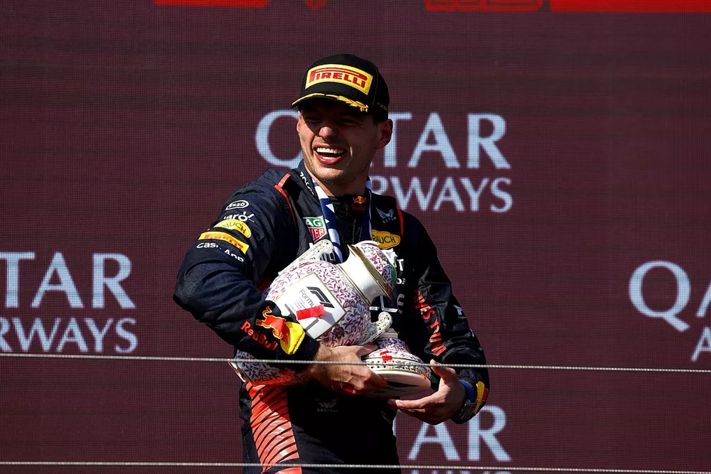 Max Verstappen, Red Bull Racing, 1st position, leaves the podium with the bits of his broken trophy
