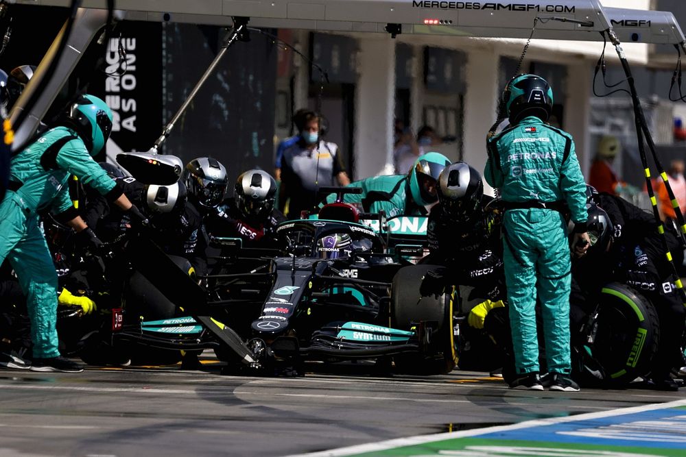 Lewis Hamilton, Mercedes W12, makes a pit stop for dry tyres