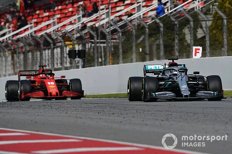 Valtteri Bottas, Mercedes F1 W11 EQ Performance, leads Charles Leclerc, Ferrari SF1000 