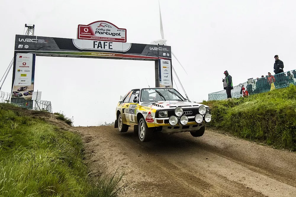Walter Rohrl drives an Audi Quattro over the Fafe jump