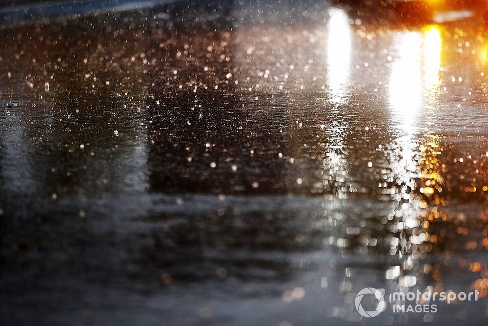 Rain falls in the pit lane