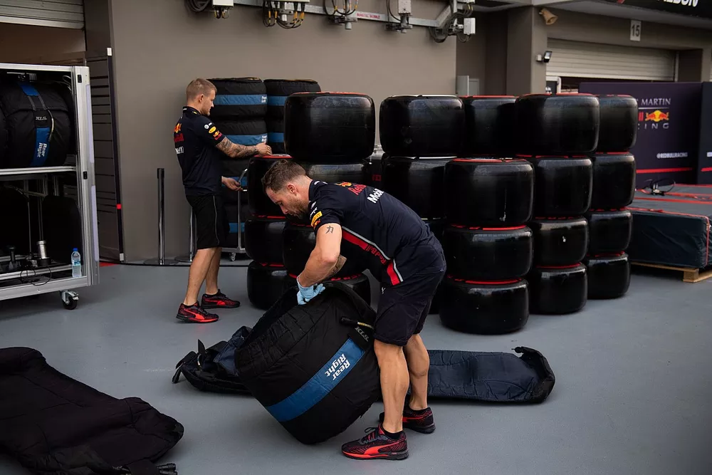 Pirelli tyres allocated to Red Bull are sorted into blankets in the paddock