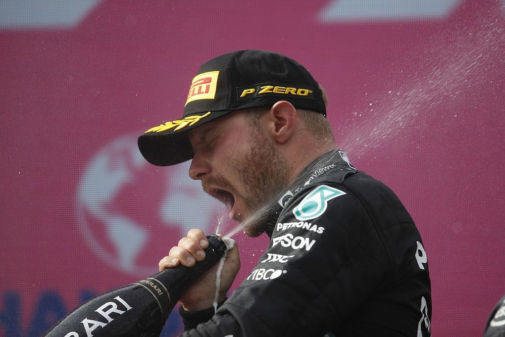 Valtteri Bottas, Mercedes, 2nd position, sprays himself with Champagne on the podium